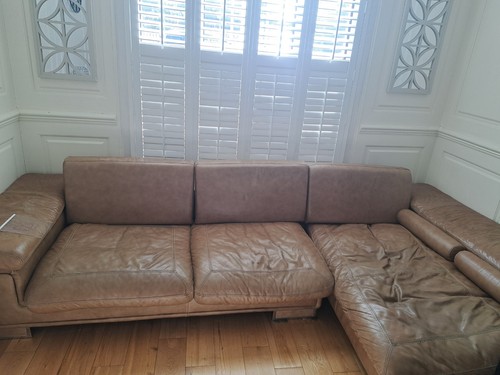 Shaped tan leather - , sofa